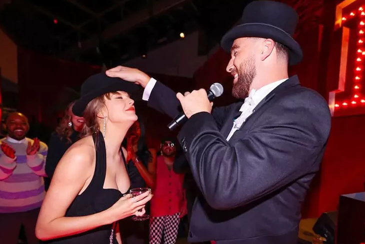 Travis Kelce Gives Taylor Swift the ‘Last 22 Hat’ at the ‘Giant Surprise’ Eras Tour Party He Threw