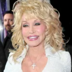 Dolly Parton smiling in a classic portrait, reflecting her timeless country music influence.