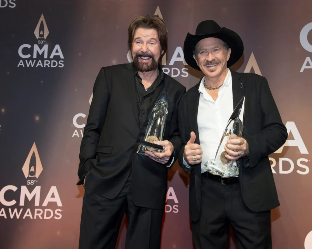 Brooks & Dunn with their trophies for Vocal Duo of the Year at the 2024 CMA Awards.