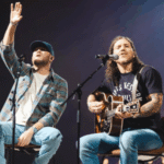 Cole Swindell Brandon Lake performing together on stage in Atlanta