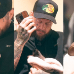 Jelly Roll smiling while holding quokka Loretta in Australia