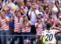 Watch 70,000 Fans Singing "Country Roads" Following Historic World Cup Win
