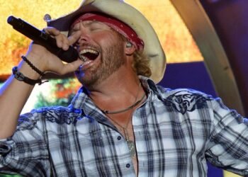 Here are a few options under 70 characters:
- The origins of Toby Keith's famous patriotic song explained
- How Toby Keith wrote his most well-known patriotic anthem
- The background story of Toby Keith's biggest patriotic track