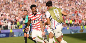 US soccer fans belt out Country Roads after big tournament win