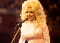 Dolly Parton smiling during her legendary country music career.