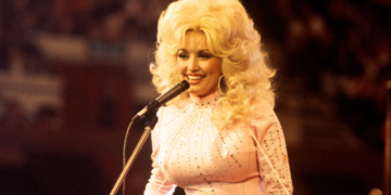 Dolly Parton smiling during her legendary country music career.