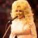 Dolly Parton smiling during her legendary country music career.